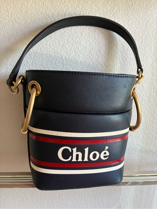 Chloe Handbags - Chloé Roy Bucket Bag – Black Leather with Red/White Stripe Logo
